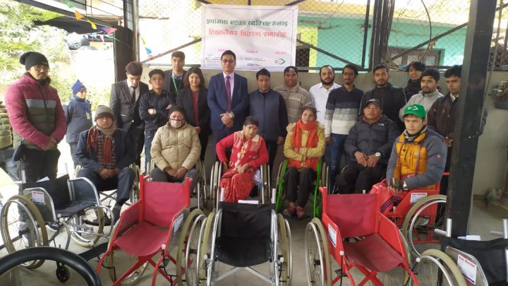 Group photo of wheelchair distribution program