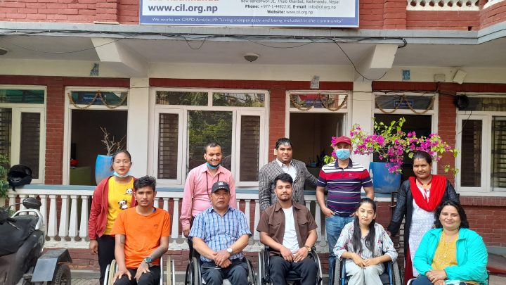 after a session, participants and facilitators(10 People) are lying in two row for the photo session