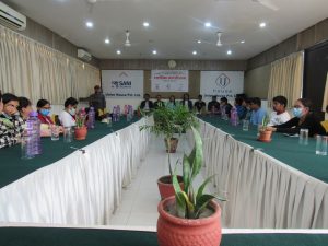 In the formal program, around 30 participants are seated on floor and guest on the dais.