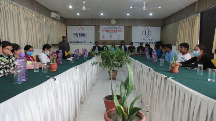 In the formal program, around 30 participants are seated on floor and guest on the dais.